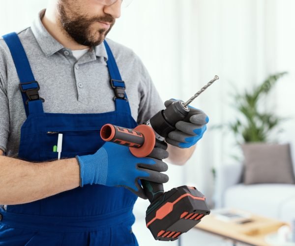 Professional handyman using a drill